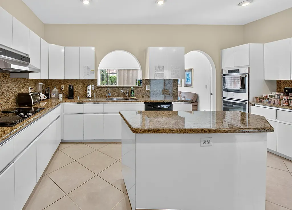 Outdated 1990s dark oak kitchen before remodel